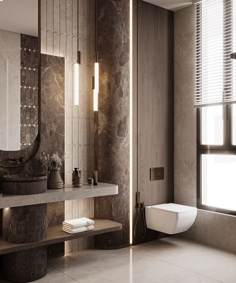 🇺🇸 This breathtaking bathroom, designed by Toka Ahmed, masterfully combines modern minimalism with inviting earthy tones. The curved mirror, elegant marble accents, and clean, sleek lines come together to craft a serene, spa-like ambiance ✨ 🇫🇷 Cette salle de bains à couper le souffle, conçue par Toka Ahmed, combine magistralement le minimalisme moderne avec des tons terreux et accueillants. Le miroir incurvé, les accents en marbre élégants et les lignes épurées et nettes s’unissent pour crée... Art Deco Bathroom Vanity, Luxury Toilet, Curved Mirror, Bathroom Design Black, Textured Wood, Washroom Design, Portfolio Design Layout, Stunning Interior Design, Bathroom Design Inspiration