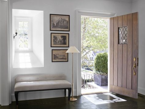 Bench In Front Of Window, Black Tile Bathrooms, Antique Brass Floor Lamp, Reclaimed Wood Beams, Upholstered Daybed, Entrance Foyer, Foyer Design, Black Tiles, Atlanta Homes