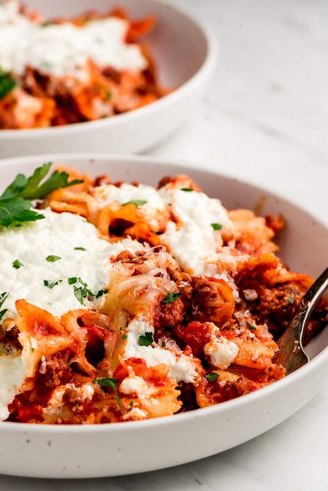 Skillet Lasagna in a shallow bowl and garnished with parsley. One Pot Lasagna Skillet, No Pasta Lasagna, One Skillet Lasagna Recipe, Lasagna Bowl, Easy Lasagna Skillet, Bow Tie Pasta Recipes Ground Beef Skillet Lasagna, Lasagna Pasta Skillet, Pasta Lasagna, Skillet Lasagna Recipe