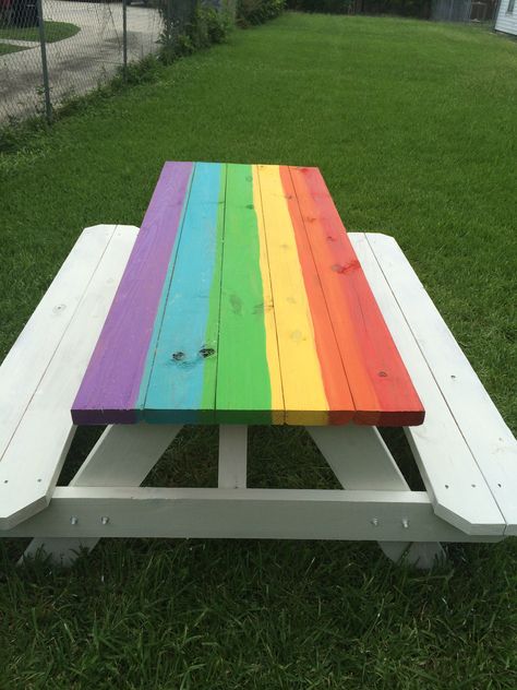 Rainbow color washed picnic table. I bought a bunch of sample paints for $2.99 each and mixed prob 3 tbsp half and half with water then applied with a brush. Painted the rest white again half and half with water. More to come once umbrella is up. Rainbow Picnic Table, Snowball Stand, Rainbow Picnic, Boy Craft, Painted Picnic Tables, Mix Match Chairs, Wood Patio Table, Rainbow Table, Camp Ground