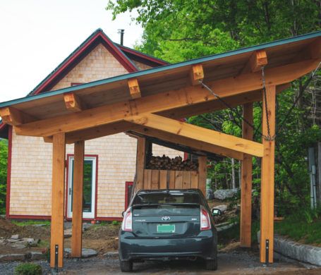 The Vermont Timber Frame Solar Carport Timber Framed Carport, Wood Beam Carport, Solar Carport Ideas, Shed Roof Carport, Car Port Ideas Carport Designs, Rustic Carport, Car Port Ideas, Timber Frame Carport, Parking Canopy