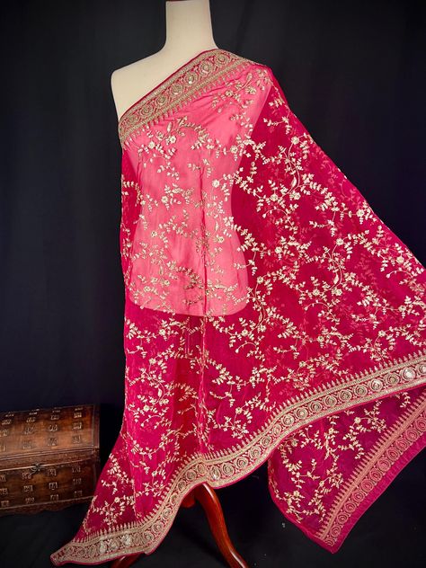 Gorgeous Hot Pink Color Soft Organza Silk Dupatta with Embroidery, Gold Zari & Sequin Work Enhance your ethnic wardrobe with this beautiful red organza silk dupatta, designed to exude grace and elegance. Crafted from premium-quality soft organza silk, this dupatta features intricate embroidery, shimmering zari work, and delicate sequin embellishments, adding a touch of luxury to any traditional outfit. The lightweight and sheer texture of this dupatta makes it easy to drape, offering a regal and flowy silhouette. Whether you're dressing up for festivals, weddings, parties, or cultural events, this dupatta is a versatile accessory that pairs beautifully with lehenga cholis, anarkali suits, salwar kameez, shararas, and sarees. Add this stunning embroidered organza dupatta to your ethnic coll Sheer Texture, Zari Embroidery, Sequin Wedding, Hot Pink Color, Traditional Outfit, Embroidered Organza, Ethnic Looks, Organza Dupatta, Zari Work