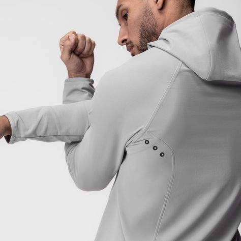 Performance-driven design for warm-ups and training. Constructed from a soft, brushed performance material to maintain body heat in cooler weather. Advanced ergonomic side seam panels with heat-pressed holes allow freedom of movement and ventilation. Featuring hand pockets with reflective bartacks, blackout front zipper, elastic binding hems for a tailored fit, and reflective detailing throughout. Model is 5'11 170lbs and usually wears size M. This product fits true to size so he is wearing size Activewear Details, Technical Apparel, Clothes Brand, Winter Running, Technical Clothing, Summer 2025, Running Man, Cooler Weather, Slate Grey