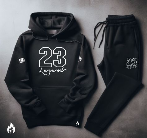 Yo, you looking for the freshest, most comfortable gear that perfectly matches your kicks? Check out our "23 Legend" Black and White Sneaker Sweatsuit To Match Air Jordan Retro 1 High OG black and white colorway! .Our comfortable men's sneaker matching sweatsuit is made from high-quality materials, so you can rock it all day. So don't wait. Cop now and step up your game with our FIRE! "23 Legend" Men's Black Sweatsuit To Match Air Jordan Retro 1 Check out our SneakerThreads Blog for all things s Black Men Outfits Swag, Sweatsuits Men, Men Outfits Swag, Air Jordan Retro 1 High, Black Sweatsuit, Matching Sweatsuit, Air Jordan Retro 1, Outfit Layouts, Dickies Shorts