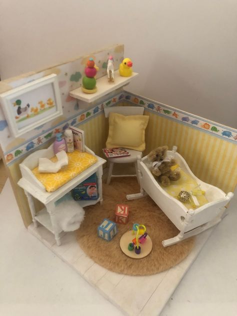 A handmade Book End showing a baby's nursery. Included are a cot with bedlinen, a rattle and a Teddy, a chair with a copy of Mother & Baby magazine and a cushion, a changing station complete with toiletries and a nappy. A picture and a shelf with baby toys.   This one is in shades of lemon but can be recreated in blue or pink. Customised versions can be made also. Please note as this is handmade there will be some variation from the photos of the finished item. Please ask for more details. Packaging is recycled wherever possible.  Delivery times allow for individual creation of each piece but if you require it quicker please send a message and we can tell you if that is able to be met.  In some instances additional postage costs will have to be added to ensure you receive it on time. Big Doll House, Barbie Bebe, Tiny Nursery, Cleaning Inspiration, Baby Doll Nursery, Doll Furniture Diy, Diy Barbie Furniture, Paper Doll House, Changing Station