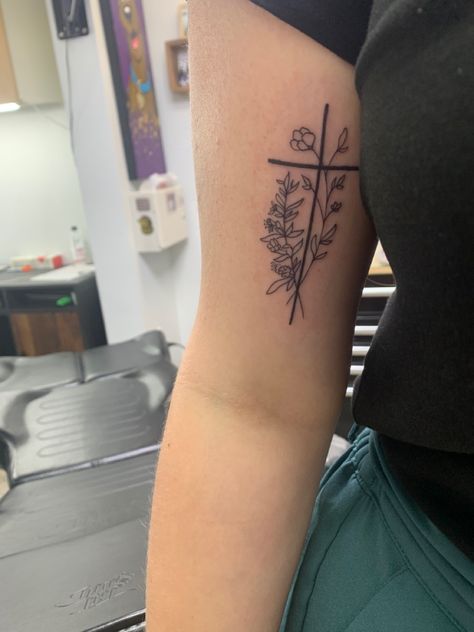 Cross And Floral Tattoo, Cross On Bicep Tattoo, Flower Western Tattoo, Bible Verse Flower Tattoo, Cross Flowers Tattoo, Cross Forearm Tattoos For Women, Lower Arm Tattoos For Women Simple, Birth Flower Cross Tattoo, Sidearm Tattoos For Women