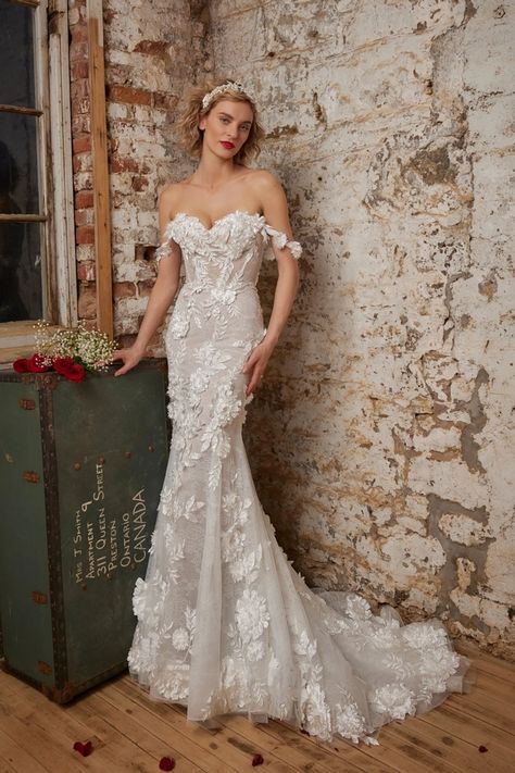 Calla Blanche Style #123247. <div class="product-detailed-description theme-typo">With 3D floral lace that blooms as magnificently as the flowers in your bouquet, Geneva is a magical display of artistry only rivaled by the alps found near her namesake. Her mermaid silhouette accentuates your curves, while her strapless sweetheart neckline exudes elegance and grace with an option to turn her into an off-the-shoulder gown for an ultra-romantic touch. Brides also have the o Mermaid Wedding Dress With 3d Flowers, Wedding Dress Floral Applique, Floral Mermaid Wedding Dress, 3d Flower Wedding Dress, Fit And Flare Wedding Dresses, 3d Floral Wedding Dress, Tulle Wedding Dress Mermaid, Earthy Wedding Dresses, Engagement Mehendi