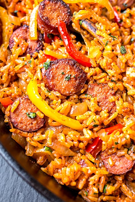 This smoked sausage and red rice skillet is filled with sausage, peppers, and onions, and a hint of tomato—it's the ultimate quick and easy one pan meal! | thecozyapron.com #smokedsausageandredriceskillet #smokedsausage #redrice #skilletmeal #onepanmeal #onepotmeal #ricedish Rice Ideas, Pasta Sausage, Sausage And Rice, Smoked Sausage Recipes, Rice Skillet, Sausage Dishes, Red Rice, Dinner Chicken, Chicken Fried