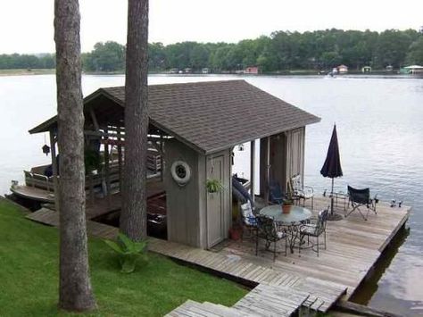 There is something so wonderful about boathouses and we sure do get to see such beautiful ones on the amazing Three Lakes Chain of Lakes. Wether you are a boathouse owner or just a boathouse lover … Boat House Storage, Boat Docks Lake Ideas, Lake Backyard Ideas, Docks On The Lake Ideas, Boat House Ideas Lakes, Boat Dock Ideas Lakeside, Rustic Boathouse, Boat House Ideas, Lake Docks Designs