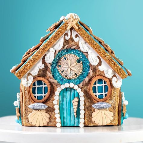 My friends over at @bakerybling sent me their Winter Wonderland Designer Gingerbread House kit along with a selection of beautiful blingy… | Instagram Gingerbread House Ideas Beach Theme, Coastal Gingerbread House, Mermaid Gingerbread House, Under The Sea Gingerbread House, Beachy Gingerbread House, Beach Themed Gingerbread House, Winter Wonderland Gingerbread House, Beach House Gingerbread House, Gingerbread House Beach