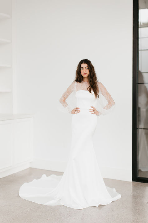 Lionheart by Tara LaTour | Fitted, Fit & Flare Silhouette. Stretch Crepe Back Satin, Removable Off-The-Shoulder Sleeves with Organza and Pearl Insets. Cathedral Train. Available with or without Sleeves. For additional information please email: info@taralatour.com #weddingdress #bridalgown #classy #elegantweddingdress #uniqueweddingdress #modernromantic Removable Sleeves Wedding Dress, Tara Latour, Dramatic Wedding Dress, Lace Top Wedding Dress, Lace Wedding Dress With Sleeves, Long Sleeve Wedding Dress Lace, Fit And Flare Wedding Dress, Fit And Flare Skirt, Bridal Salon