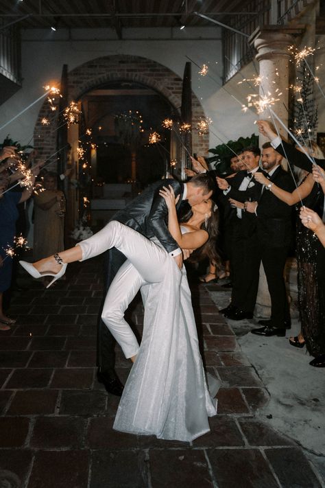 The bride and groom exit their wedding reception with sparklers for their New Year's Eve wedding. | Photo: Sara Ascencio | Venue: The Bell Tower on 34th | #weddingsinhouston #brideandgroom #realwedding #winterwedding #houstonwedding #weddinginspo #weddingideas #weddingexitideas #newyearsevewedding #winterweddinginspo #weddingphotographhy #weddingphotos Grand Exit Wedding, Sangeet Photos, Wedding Grand Exit, Bride And Groom Exit, Reception Exit, Wedding Exit Ideas, Sparkler Exit Wedding, Alfresco Wedding, Hill Country Wedding Venues