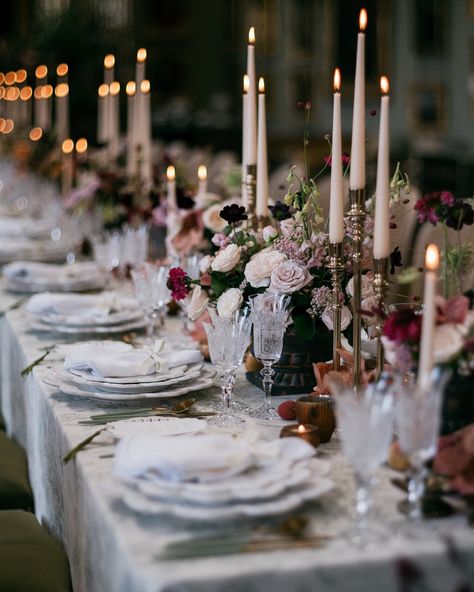 Sultry tones at the iconic Somerley House At the end of summer we visited the beautiful Somerley House in Hampshire to create a trilogy of immersive spaces. We filled the Picture Gallery with rich, sumptuous tones and candlelight to create a romantic and sultry wedding breakfast for guests to dine in. The floral installation created the backdrop to our scene and framed the divine portrait at the end of the hall. The installation was filled with fluffy hydrangea, endless roses and sunset co... Sultry Wedding, Somerley House, August Weddings, Floral Installation, August Wedding, Organic Wedding, Dine In, Wedding Breakfast, Wedding Florals