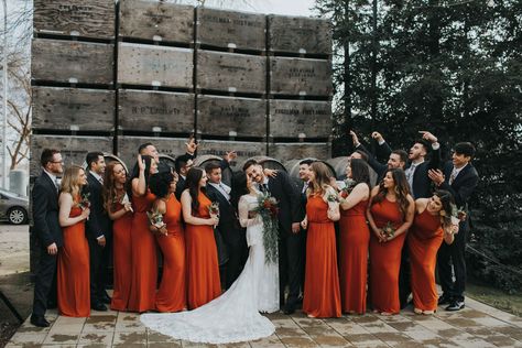 Burnt orange is probably my top favorite color for bridesmaids dresses! These simple, modern bridemaids dresses complimented this boho wedding dress perfectly. A gorgeous combo with the guys wearing simple black tuxedoes, with a Californian winery backdrop! #autumncolorpalette #californiawinerywedding #burntorangebridesmaidsdress Rust Orange And Black Wedding, Burnt Orange And Black Wedding Theme, Black Burnt Orange Wedding, Black Gold Burnt Orange Wedding, Black Orange Wedding, Black And Orange Groomsmen, Black Red And Orange Wedding, Rustic Orange Bridesmaid, Orange And Black Wedding Theme