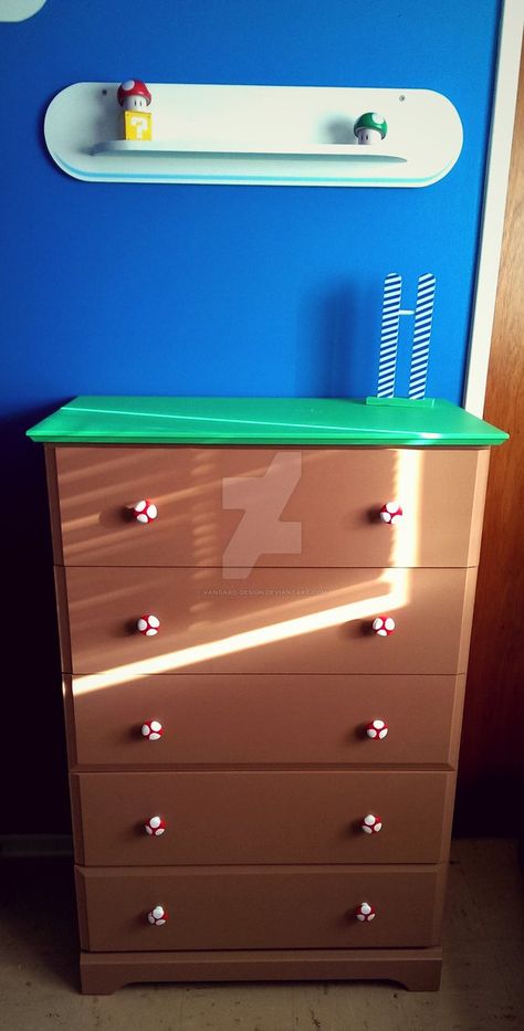 This is the dresser I did for my super mario world themed nursery, I wanted it to look like the blocky hill type things in the game. We decided to paint the knobs for the dressers to look like the ... Mario Brothers Bedroom Ideas, Nintendo Themed Bedroom, Mario Dresser, Super Mario Bedroom Ideas, Mario Bedroom Ideas Boys, Mario Room Ideas Boys, Mario Bros Room, Nintendo Room, Super Mario Room