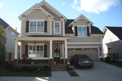 SCHEME: 19. Clover Creek. 217 Clover Lane. STONE: Southern Ledgestone Walnut. SIDING: Tony Taupe SW7038. SHAKE: Sandbar SW7547. TRIM: Snowbound SW7004. ACCENT: Vandyke Brown SW7041. GUTTERS: 30 White. www.windsonglife.com Tony Taupe Exterior House, Tony Taupe Exterior, Taupe Exterior House, Taupe House, Tony Taupe, Taupe Exterior, Vandyke Brown, Exterior Siding Colors, Front Porch Railings