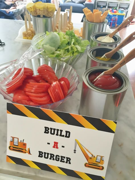 Build-a-Burger food station for a construction-themed birthday party.  Empty paint cans with small paint brushes make a great way to serve and display condiments. See more photos, décor and DIY project details from this party at www.fabeveryday.com. Dump Truck Birthday, Construction Theme Birthday Party, Construction Theme Party, Construction Birthday Parties, Trucks Birthday Party, Construction Theme, Construction Party, Construction Birthday, 3rd Birthday Parties