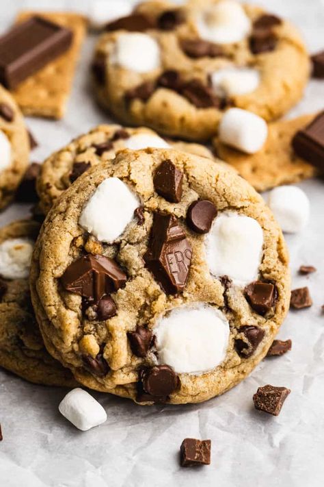 Our delicious S'mores Cookies start with a thick and chewy graham cracker cookie base, loaded with chocolate and marshmallows. Crumbl Cookie Copycat Smores, S'more Cookies Recipe, Chocolate Chip Cookie S’mores Recipe, Smore Cookies Easy, Take 5 Cookies, S’more Chocolate Chip Cookies, Peanut Butter Smores Cookies, S’more Cookie Recipe, Smores Cookie Recipes