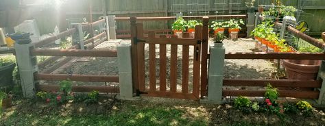 Summer flower beds,  diy fence, Cinder blocks, million bells, blue Salvia, purple and pink verbena Cinder Block Fence With Gate, Cinder Block Fence With Wood, Cinder Block Fence Ideas, Summer Flower Beds, Cinder Block Fence, Salvia Purple, Decorating Rv, Flower Beds Diy, Outdoor Upgrades