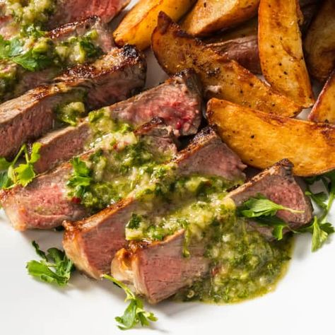 New York Strip Steaks with Crispy Potatoes and Parsley Sauce | America's Test Kitchen Smoked Chili, Green Pesto, Jamie Oliver Recipes, Seared Steak, Smoked Beef, Tri Tip, Strip Steak, Smoker Recipes, Juicy Tomatoes