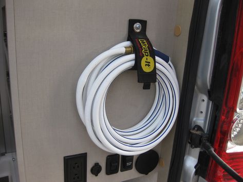 Winnebago Travato 59K Custom Hose and Tire Jack Storage | Teal Sky Travato 59k Mods, Travato 59k Hacks, Jayco Camper Trailer Storage Ideas, Camper Hose Storage Ideas, Rv Sewer Hose Storage Ideas, Geo Pro Travel Trailer Hacks, Rv Sewer Hose Support, Inexpensive Diy Gifts, Class B Rv