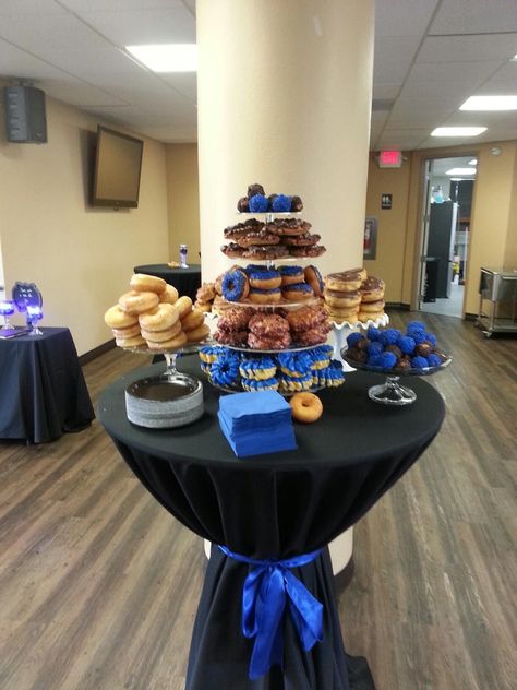 Donut bar. Had blue donuts, but also added maple bacon, apple fritters, Bavarian creme. The donuts were a big hit. Placed bags next to display for guest to take home Nypd Retirement Party Ideas, Police Awards Banquet, Police Gala Decorations, Police Officer Graduation Party, Donut Bar Graduation Party, Police Centerpiece Ideas, Police Graduation Party, Sheriff Party Ideas Deputy, Law Enforcement Retirement Party