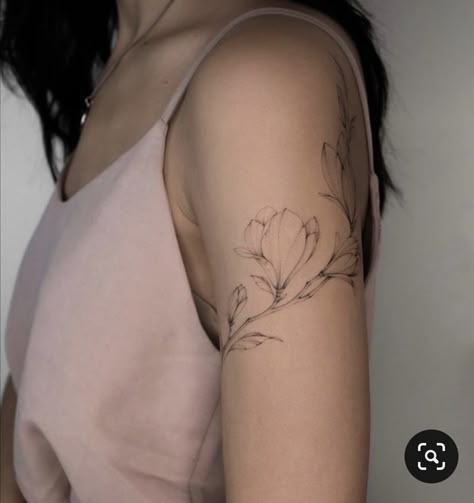 Floral Wrap Around Tattoo Shoulder, Floral Space Filler Tattoo, Feminine Flower Tattoos Arm, Magnolia Tattoo Upper Arm, Flower Tattoo Placement Ideas Arm, Magnolia Arm Tattoos For Women, Upper Arm Floral Wrap Tattoo, Magnolia Wrap Around Tattoo, Fineline Shoulder Tattoos For Women