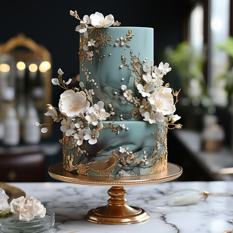 Beautiful elegant emerald and golf wedding cake with beautiful flowers Wedding Cakes Fairytale, Wedding Cake With Emerald Green, Enchanted Garden Wedding Cake, Emerald And Gold Wedding Cake, Enchanted Wedding Cake, Celtic Wedding Cake, Gold Green Wedding Cake, German Wedding Cake, Elven Wedding Cake