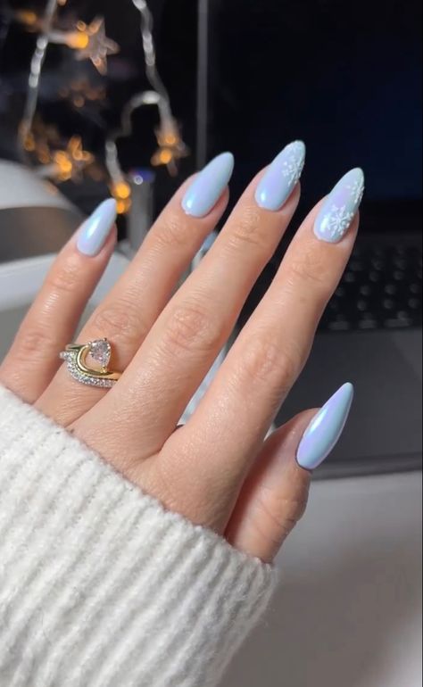 Credit tiffanyabbigailebeauty #nails #nailart #nailideas #nailtrends #nailsofinstagram #naildesign Mail Inspo January, Winter Nails Simple Almond, January Nails Oval, Oval Snowflake Nails, Christmas 2024 Nail Trends, Nails Almond Winter, Almond January Nails, Icy Blue Christmas Nails, Cute January Nails Almond