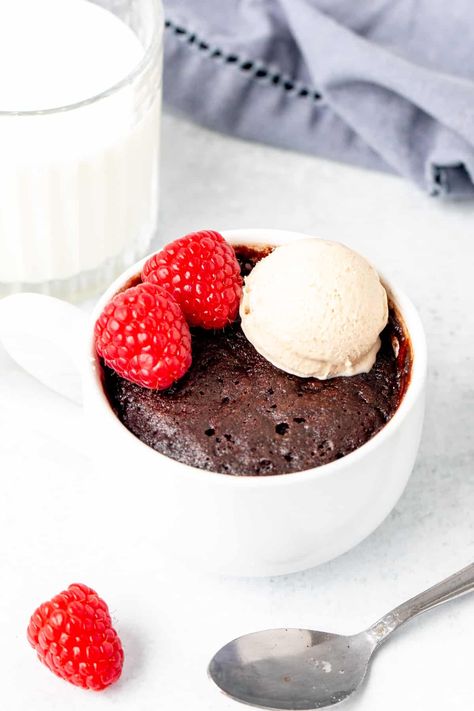 This chocolate mug cake is moist, fudgy, a little gooey and perfect for when your chocolate craving hits. It's ready in minutes and made in the microwave. Serve with a scoop of ice cream for the perfect chocolate treat. Moist Chocolate Mug Cake, Vegan Chocolate Mug Cake, Vegan Mug Cakes, Clean Treats, Lemon Mug Cake, Gf Food, Chocolate Mug Cake, Gf Baking, Single Serve Desserts