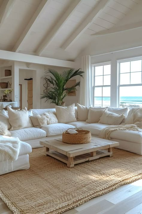 17 Beach House Living Room Designs That Will Make Your Home Feel Like A Permanent Vacation White House By The Sea, Vacation Home Living Room, Luxury Beach House Living Room, Malibu Home Aesthetic, Country Coastal Home, Cozy Beach House Interior, White Modern Beach House, Coastal Hamptons Style Living Rooms, Hamptons Style Decor Living Rooms