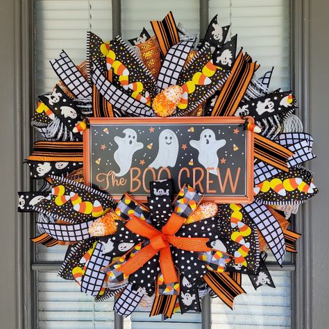 Get Into The Halloween Spirit With This Spooky Ghost Wreath! This Wreath Is Made With Premium Deco Mesh, Foam Candy Corn And Coordinating Wired Ribbon. Also Attached Is An Adorable Metal Ghost Sign That Reads " The Boo Crew" This Handmade Wreath Is Perfect For Halloween. This Wreath Is Sure To Add An Adorable Eerie Touch To Your Front Door Or In Your Home Measuring 21" X 21" X 7" This Wreath Should Be Displayed In An Area Sheltered From Direct Weather Elements As It May Cause Fading Over Time. A Foam Candy, Fall Ribbon Wreath, Ghost Wreath, Halloween Door Decor, Spooky Candy, Halloween Door Wreaths, Halloween Mesh Wreaths, Boho Wreath, Candy Cane Wreath