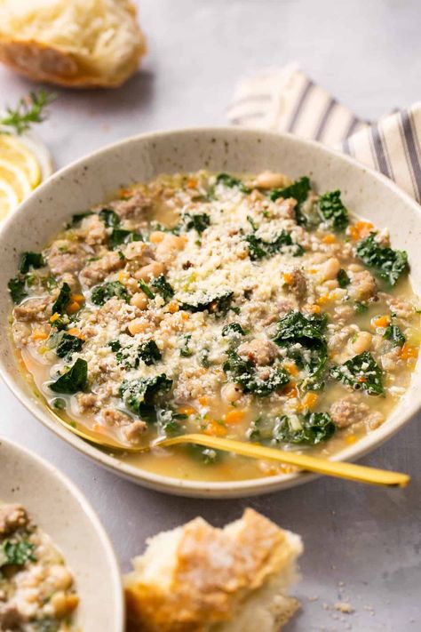 Enjoy an extra cozy and extra delicious meal with this White Bean Kale Sausage Soup. Made with a selection of veggies and Italian sausage, it supplies incredible nutrients and a great dose of protein! Kale Sausage White Bean Soup, Bean Kale Sausage Soup, Kale Sausage Soup, White Bean Sausage Soup, Kale And Bean Soup, White Bean Kale, Kale Sausage, Erin Lives Whole, Bean And Sausage Soup