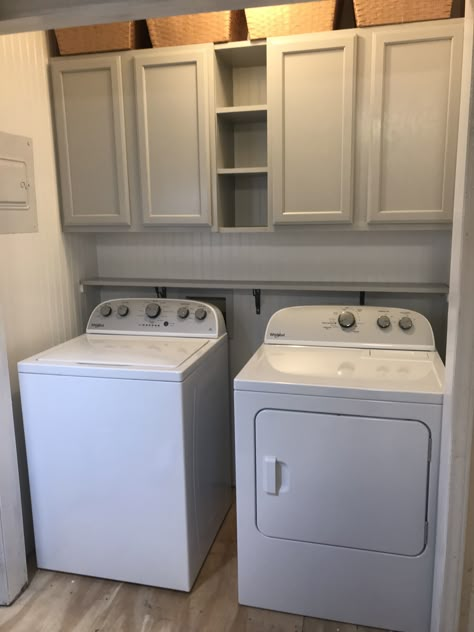 Laundry Room Shelves Between Cabinets, Laundry Room Shelf Between Cabinets, Overhead Laundry Storage, Laundry Room Ideas Cabinets And Shelves, Laundry Room With Rack, Laundry Room Overhead Cabinets, Cabinets For Laundry Room Small Spaces, Laundry Room With Upper Cabinets, Laundry Storage Above Washer And Dryer