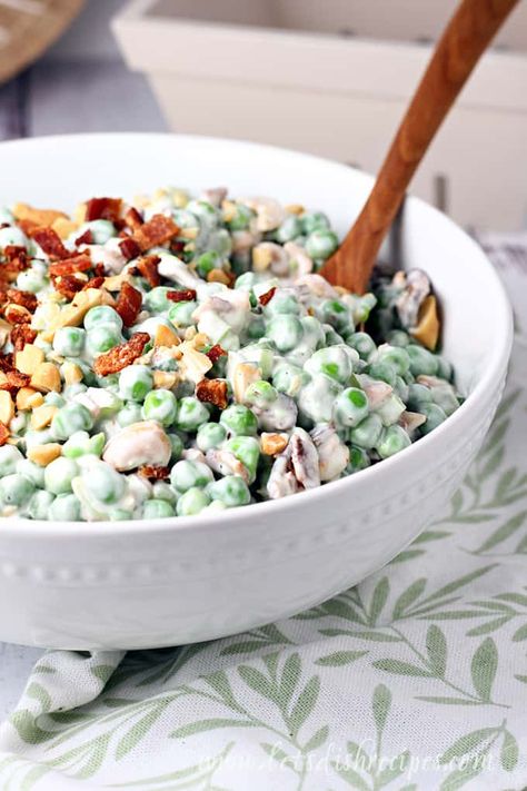 Pea Salad with Cashews and Bacon Recipe -- Peas, celery, salty cashews and crispy bacon come together in a creamy dressing to create this fresh spring salad! Pea Salad With Cashews, Cold Pea Salad, Midwest Food, Salad With Cashews, American Salad, Kosher Rules, Pea Salad With Bacon, Potluck Favorites, Picnic Salads