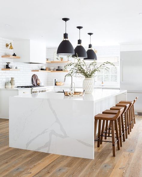 When you follow amazing interior designers on Instagram, you come across some stunning interiors. Here are the best kitchens we've seen posted lately. All White Kitchen, Marble Counter, Gorgeous Kitchens, Wood Pendant, Stunning Interiors, Counter Tops, Kitchen Inspo, Contemporary Kitchen, White Kitchen