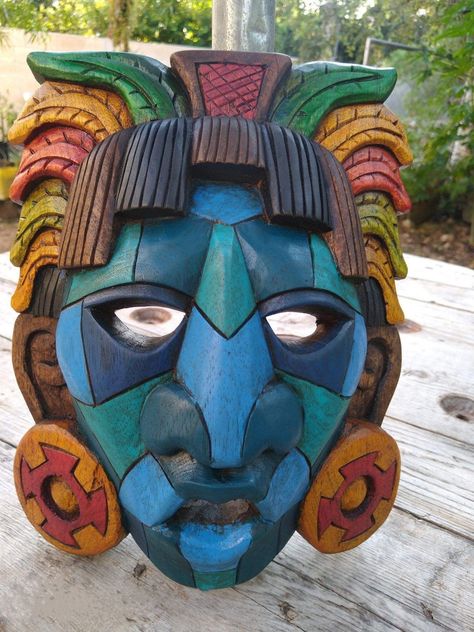 "\"Wooden Mayan mask, Mexican culture, ideal for wall decoration\" Features - Material: Cedar wood - Dimentions: 15.74 \"high approximately Excellent quality design, hand carved by Mexican artisans Mask of eternal life with the skull symbol of power, it has a jaguar on its forehead that represents darkness, light and power. The Mayan masks were used primarily in the ceremonies and funeral rites of the emperors, where the person who possessed them indicated to their gods that they should accept t Mayan Masks, Cultural Masks, Skull Symbol, Mayan Mask, Michoacan Mexico, Mexican Wall Art, Maya Civilization, Wooden Mask, Mexican Wall