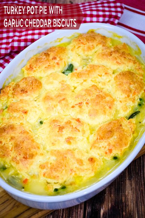 Turkey Pot Pie with Cheddar Garlic Biscuit Topping #comfortfood #leftoverturkey #garlic #biscuits #casserole Cheddar Garlic Biscuits, Turkey And Gravy, Garlic Cheddar Biscuits, Garlic Biscuits, Pot Pie Recipe Easy, Cheddar Biscuit, Turkey Pot Pie Recipe, Biscuit Crust, Turkey Leftovers