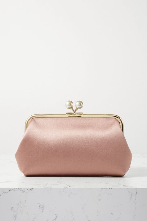 Anya Hindmarch Maud Clutch in Pink SatinEXCLUSIVE AT NET-A-PORTER. Anya Hindmarch may be best known for her playful novelty bags, but this 'Maud' clutch proves her eye for elegant, minimal design is just as good. Made from pink satin, it has a polished gold-tone frame topped with a lustrous faux pearl clasp. Store evening essentials like your phone, keys and cardholder inside and attach the shoulder strap to go hands-free. Purchase Worn by Zara Phillips on:17 June 2021 Khaite Jeans, Anya Hindmarch Bag, Fancy Purses, Types Of Handbags, Purse Ideas, Manolo Blahnik Pumps, My Style Bags, Bridesmaid Clutches, Pearl Clasp