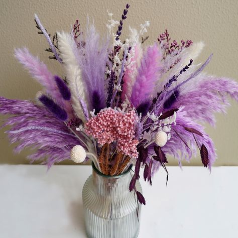 PRICES MAY VARY. Natural Dried Flowers: The Dried Flowers bouquet is a unique bouquet made from 13 naturally dried plants, including dry purple and white Pampas grassland, deep purple rabbit tail, purple wheat, purple lavender, white Billy balls and more.Elegant purple and white, total length about 17 inches, not including vase DIY: Bouquets need to be arranged, and you can also use these materials for creative DIY flower arrangements.The elegant and beautiful dried plants create a warm and natu Pompous Grass Bouquets, Purple Pampas, White Pampas, Purple Rabbit, Unique Wedding Bouquet, Mixed Bouquet, Rabbit Tail, Bouquet Purple, Vase Diy