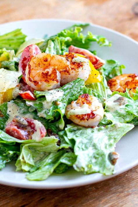 Nutritions and tasty, grilled shrimp Caesar salad is quick and easy to prepare. Featuring crispy lettuce, sweet juicy prawns, salty bacon, peppers, cherry tomatoes and the best, creamy Caesar salad dressing. It's gluten-free, low-carb and keto-friendly, with dairy-free and paleo modifications provided. #saladrecipes Prawn Caesar Salad, Shrimp Caesar Salad, Caesar Salad Wrap, Caesar Salads, Salad With Shrimp, Salad Shrimp, Shrimp Cakes, Grilled Prawns, Steamed Asparagus