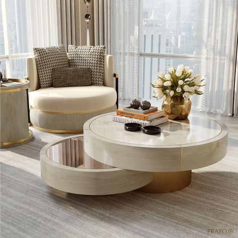 The High Life: Providing a sculptural focal point in the simply furnished living area, the AARHUS coffee table’s blend of brushed brass, glossy lacquer and bronze mirror draws attention by reflecting the view. Click the link in our bio to see the full concept in detail. #FRATO #TimelessInteriorsbyFRATO #Living #Dining #LuxuryInteriors #InteriorDesign #NYInteriors #NewYork Bronze Coffee Table Living Room, Luxurious Coffee Table, Round Center Table Living Room, Modern Luxury Coffee Table, Round Centre Table, Coffee Table Arrangment, Round Coffee Table Styling, Coffee Table Luxury, Unique Coffee Table Design