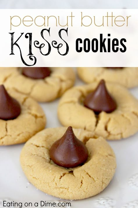 Try this delicious Peanut Butter Kiss Cookies Recipe. They are easy to make, fun to make with the kids, and very frugal to make. - Eating on a Dime Easy To Make Christmas Cookies, Peanut Butter Kiss Cookies Recipe, Kiss Cookies Recipe, Kiss Cookie Recipe, Peanut Butter Kiss, Peanut Butter Kiss Cookies, Cookie Exchange Recipes, Kiss Cookies, Blossom Cookies