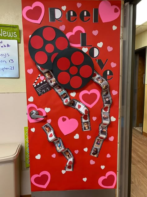 Getting the classroom ready for Valentine’s Day we decorated the door and the “film” for the reels has pictures of the kids Valentines Classroom Decorations, Valentines Door Decorations Classroom, Valentines Door Decorations, Valentines Classroom Door, Valentine Bulletin Boards, Valentines Classroom, Valentines Door, Valentines Day Bulletin Board, Classroom Door Ideas