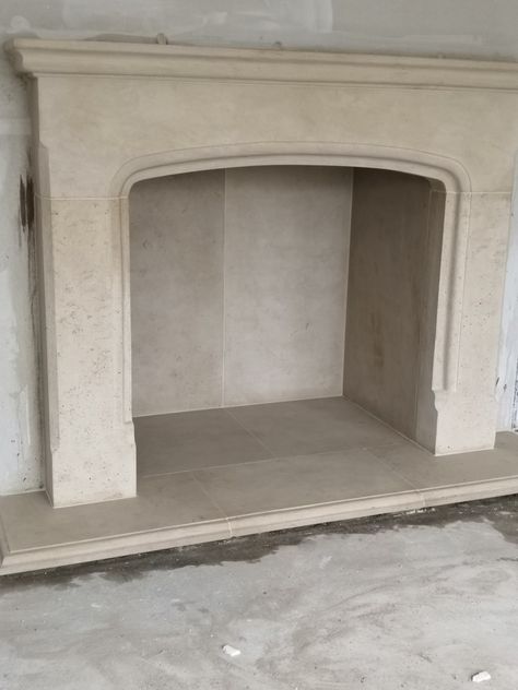 Plaster Fireplace Wood Mantle, Diy Limestone Fireplace, Rebuild Fireplace, Limestone Wall Interior, Arched Fireplace Surround, Fireplace Plaster, Limestone Mantle, French Country Fireplace, Cast Stone Fireplace Surround