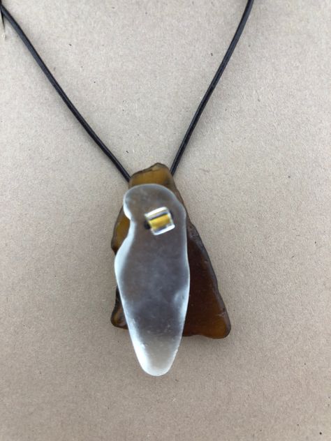 FREE SHIPPING TO U.S. ADDRESSES! Hand gathered beach glass from the shores of Lake Superior. All of the beach glass used in this pendant were shaped by Mother Nature and remain in their natural, unfinished state.   I have rubbed each piece of beach glass with a bit of coconut oil to bring out their inherent shine. After carefully selecting and hand drilling the beach glass, the pieces are placed on an adjustable genuine leather cord.   The back piece of beach glass used to create this pendant is Sea Glass Jewelry Diy, Beach Glass Projects, Beach Glass Jewelry, Beach Glass Crafts, Beach Glass Necklace, Driftwood Jewelry, Antler Necklace, Sea Crafts, Beachglass Jewelry