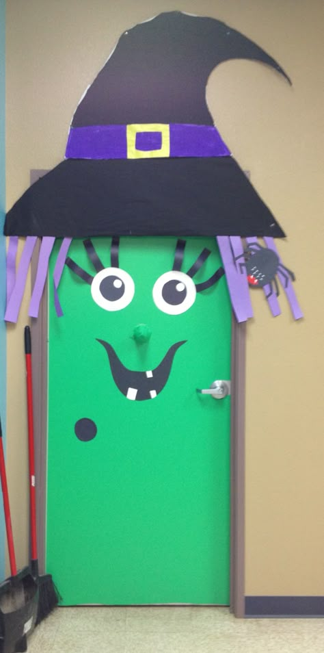 Witch door decoration I created! :) Contact paper was used for green portion. I rolled up construction paper and made a cone, then covered it with contact paper for the nose. Used a glue stick to stick the nose on. Construction paper and glue stick were used for the eyes, hat buckle, mouth, spider and eyelashes. Used googly eyes on spider. I had the kids paint black on a large piece of butcher paper and purple on a strip of butcher paper, and cut it out to size for the hat. enjoy! Witch Door Decoration, Easy Halloween Door Decorations, Halloween Life Hacks, Door Decoration For Preschool, Halloween Door Decorations Classroom, Porta Halloween, Diy Halloween Door Decorations, Halloween Classroom Door, Halloween Diy Door