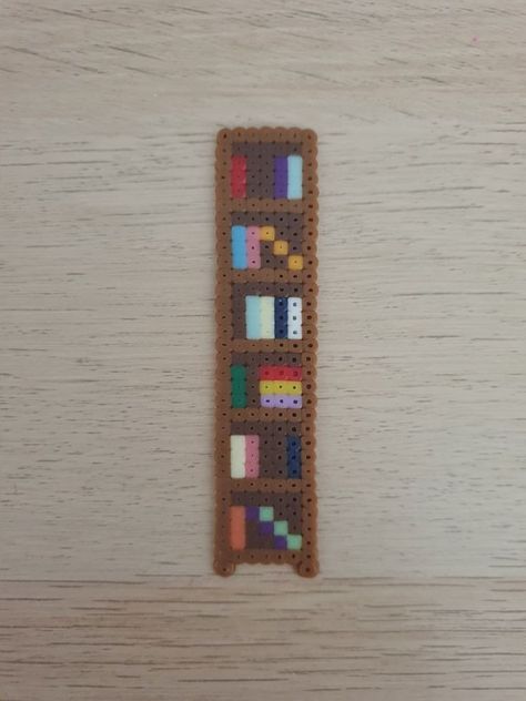 Hama Beads Design Bookmark, Perler Bead Art Bookmark, Perler Beads School Supplies, Hama Beads Patterns Bookmarks, Book Perler Bead Patterns, Stuff To Make With Perler Beads, Pixel Art Bookshelf, Hama Bookmarks, Pearler Bead Bookmark