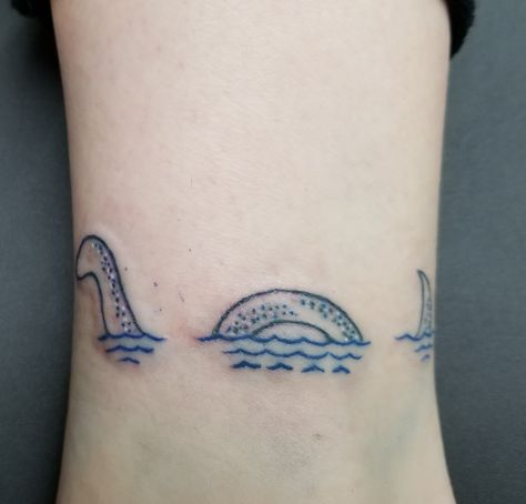 Loch ness monster tattoo Loc Ness Monster Tattoo, Lockness Monster Tattoo, Nessy Tattoo, Loch Ness Monster Drawing, Loch Ness Monster Tattoo, Nessie Tattoo, Scottish Tattoos, Mom Daughter Tattoos, Monster Tattoo