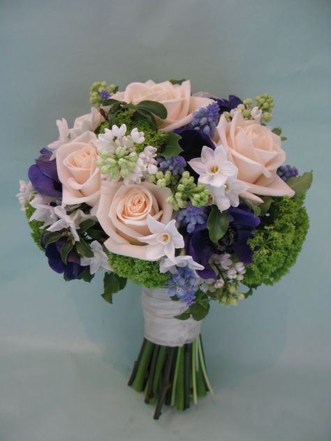 A cream and blue bridal bouquet, of Roses, Anemones, Grape Hyacinths, Lilac, Paperwhites and Viburnum. Blue Bridal Bouquet, Bridal Bouquet Blue, Bouquet Of Roses, Blue Lilac, Spring Bouquet, Blue Bridal, Flower Ideas, Flower Bouquets, Flower Beauty